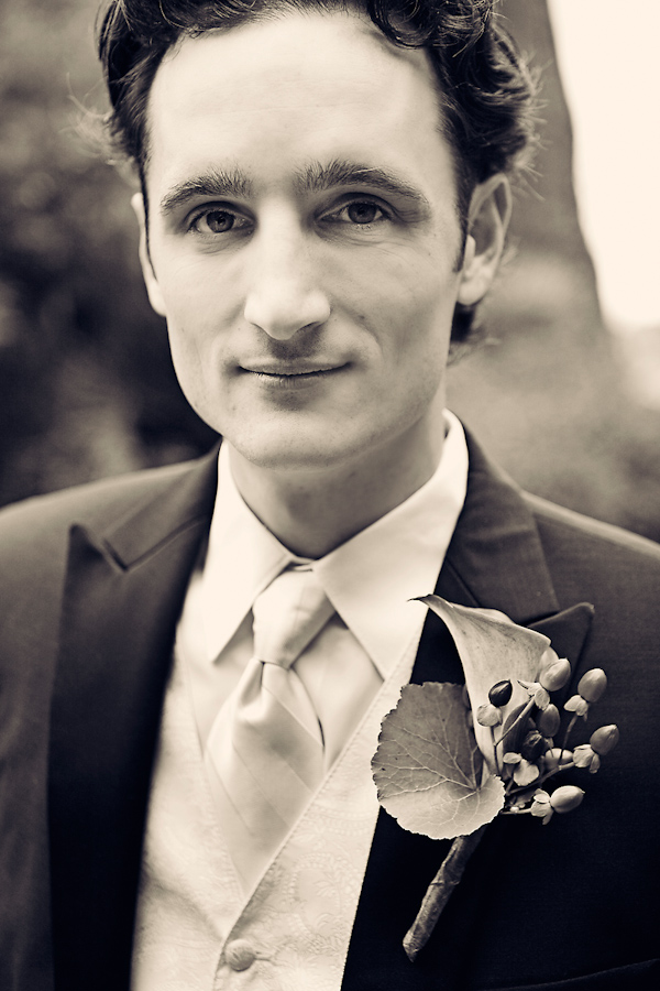 Black and white photo - Handsome groom wearing suit with vest - wedding photo by Meg Perotti